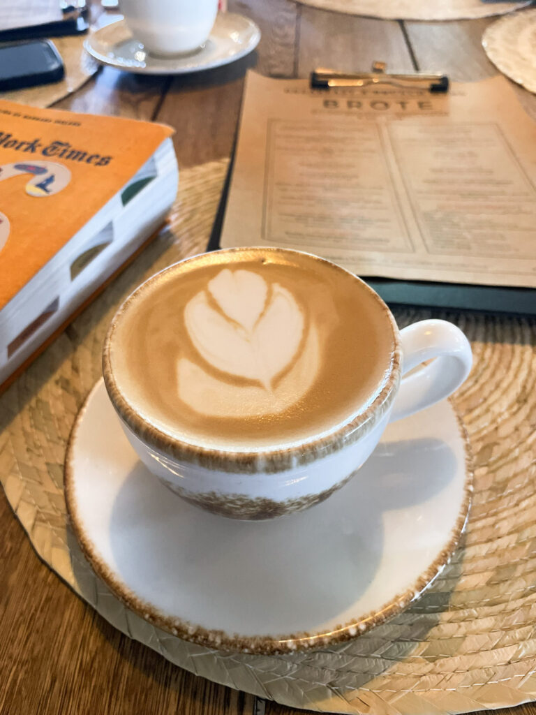 A cappuccino with a leaf design.